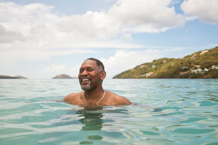 Man in ocean enjoying his vacation