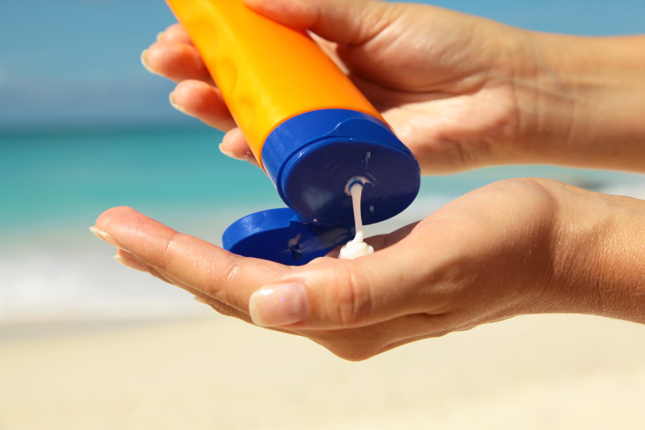 squeezing sun protection cream