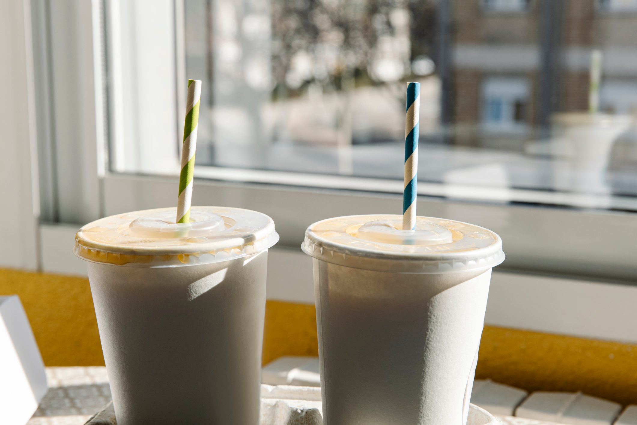 Takeaway fruit cocktails with straw