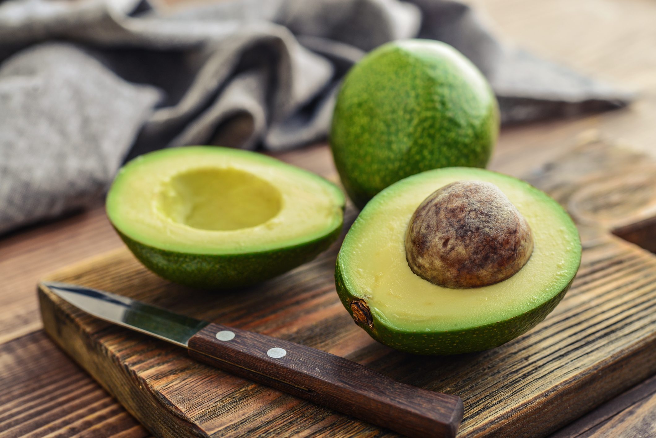 Fresh avocado on cutting board