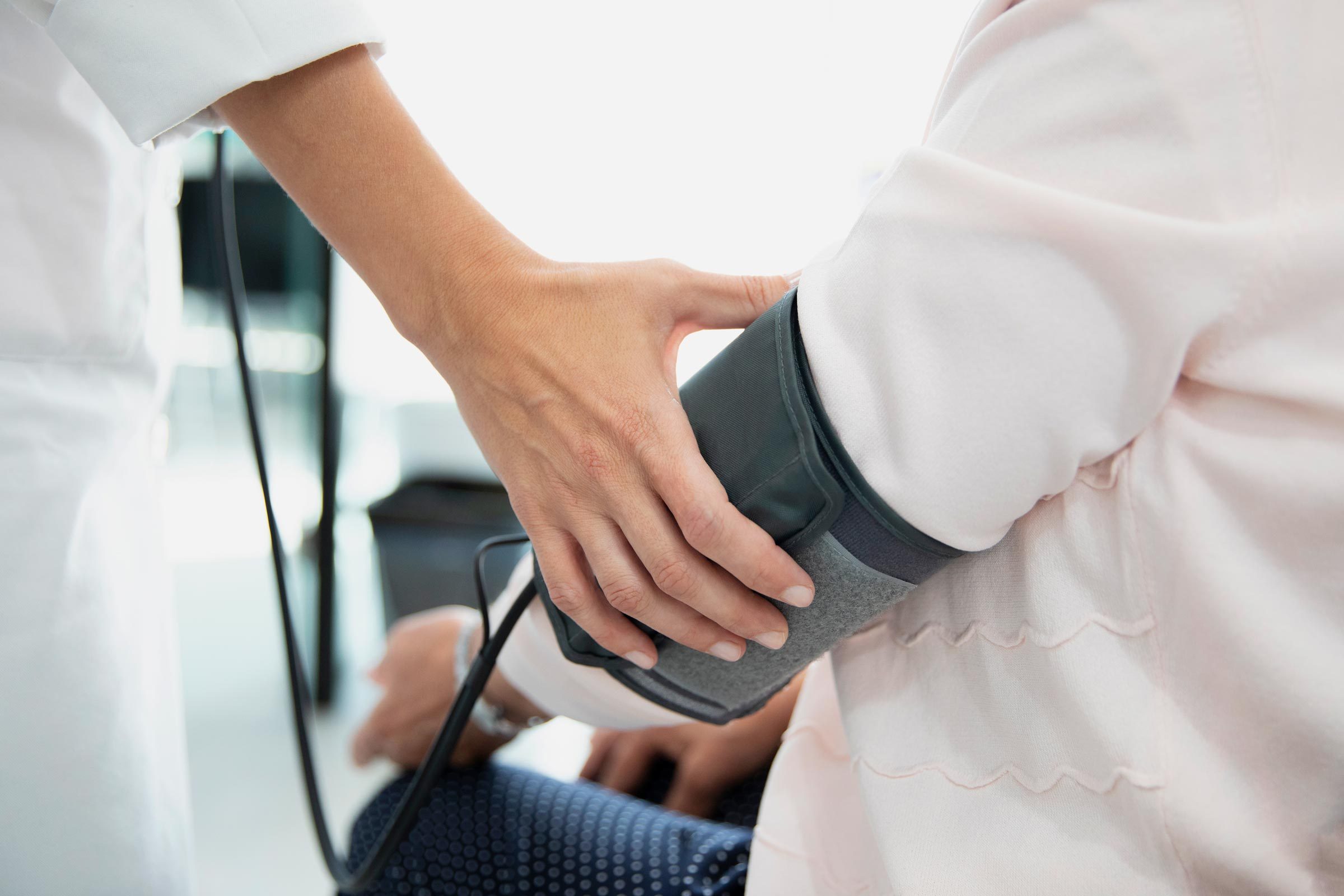 doctor measuring a patient's blood pressure