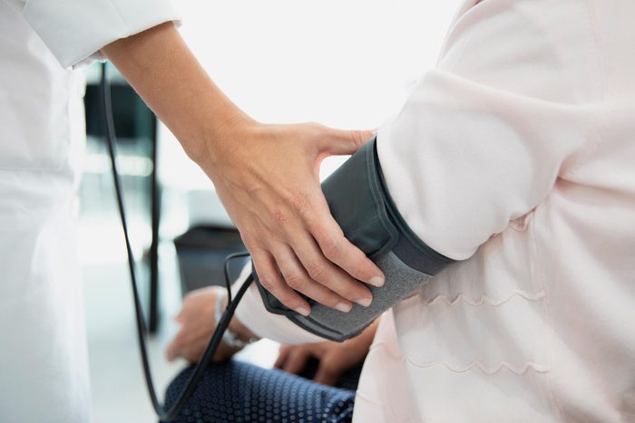 doctor measuring a patient's blood pressure