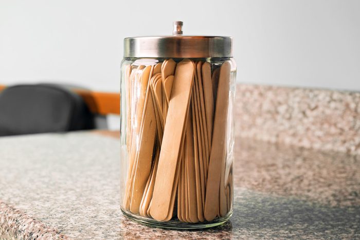 tongue depressors in a jar
