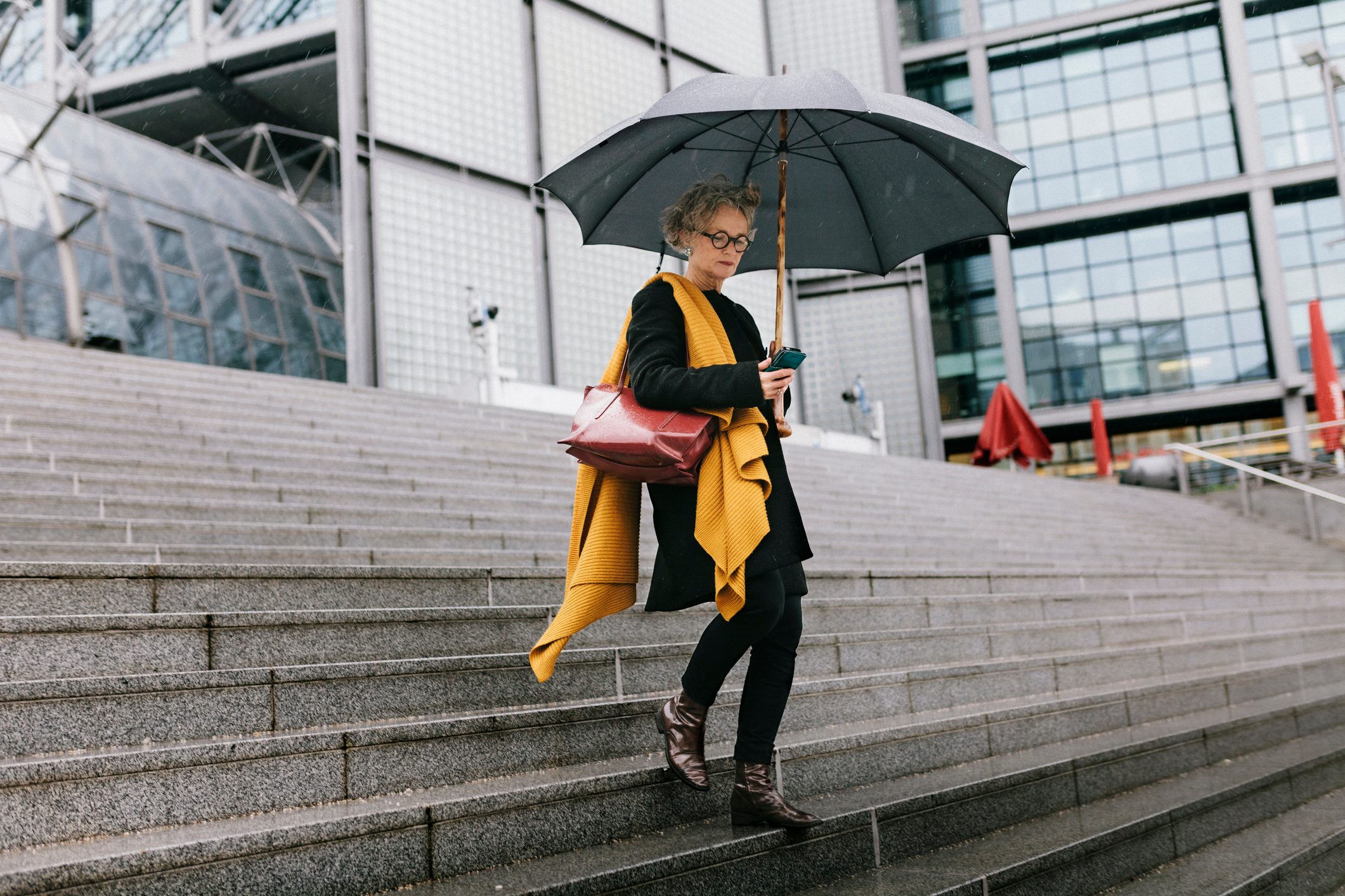 Businesswoman Walking In The Rain