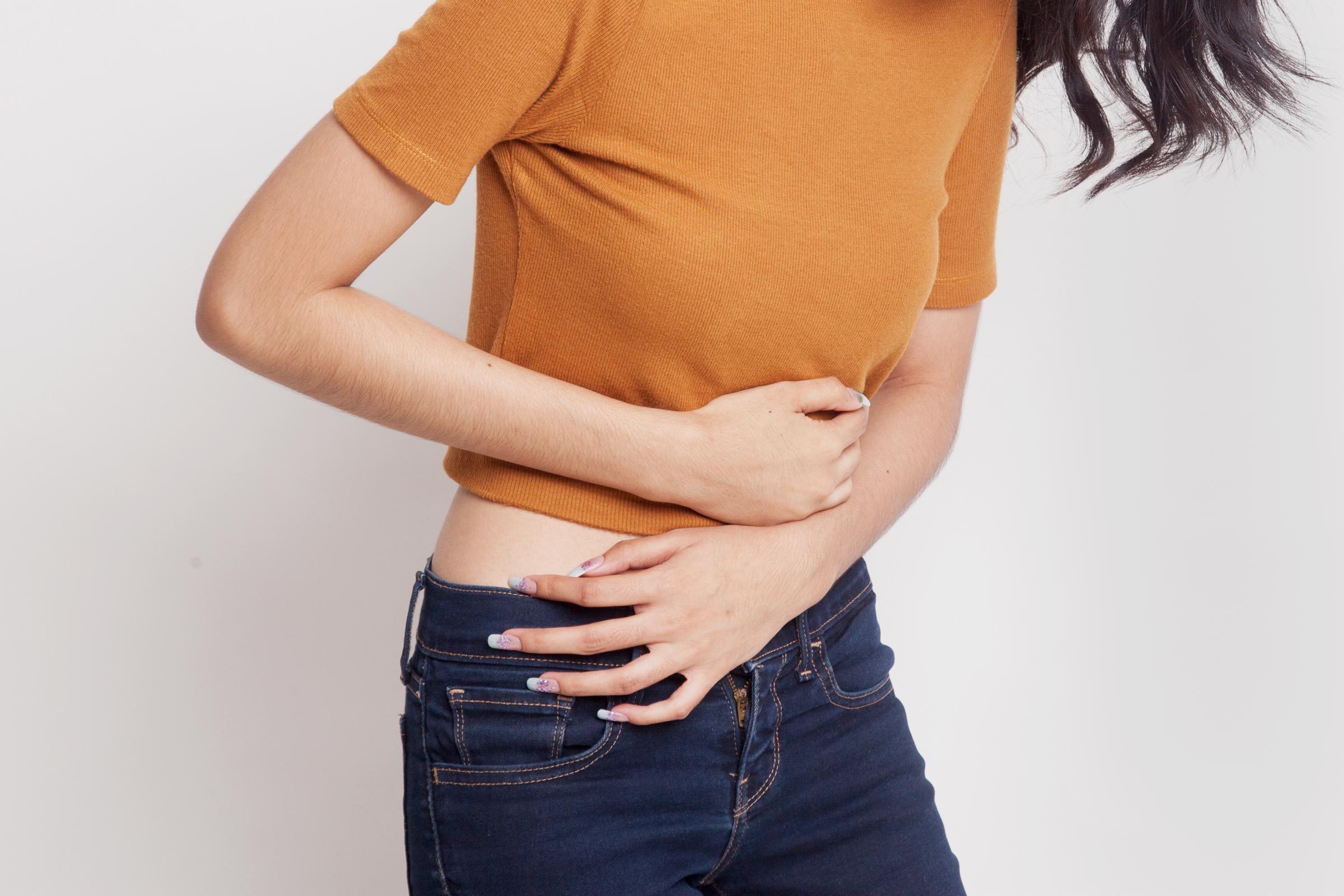 woman holding stomache