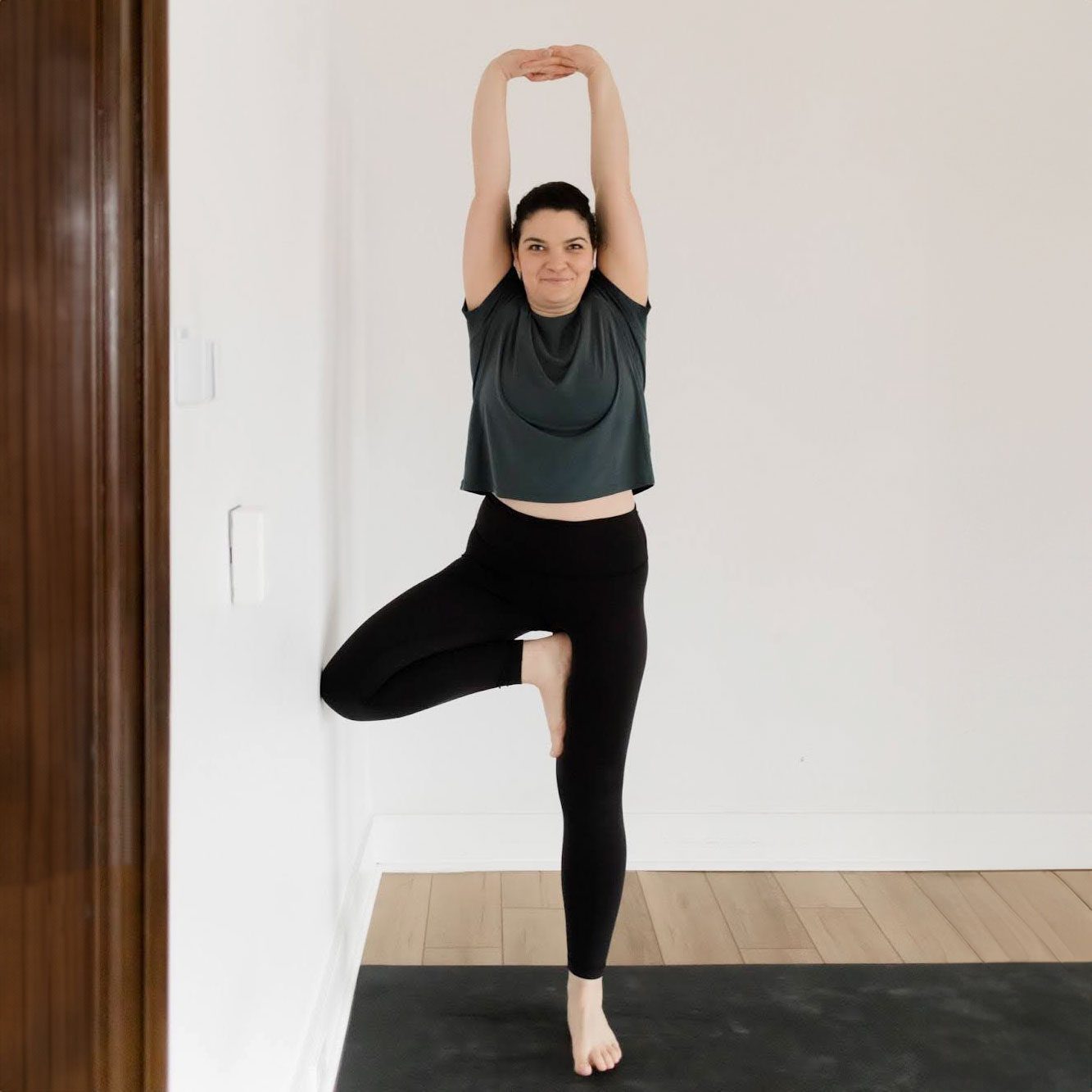 Tree pose at the wall 