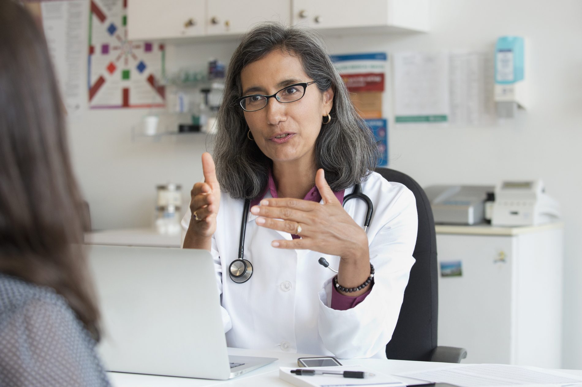 doctor talking to anonymous patient