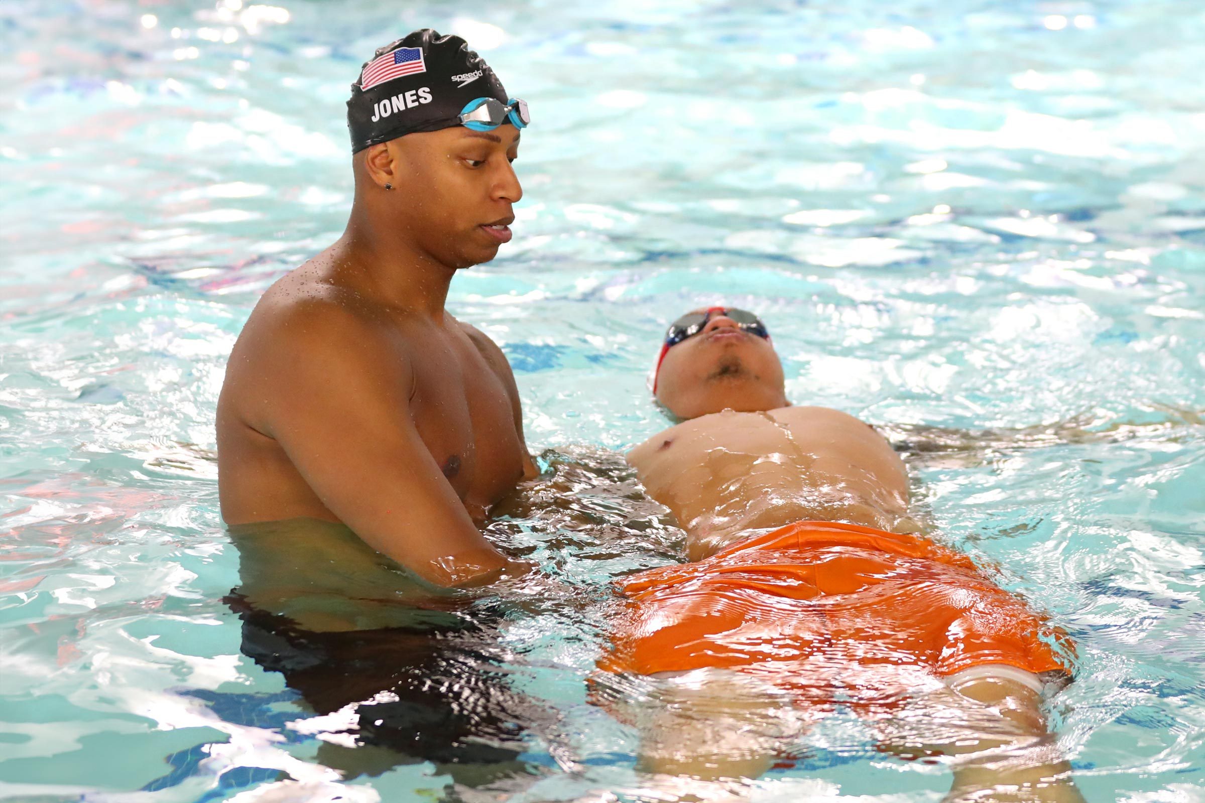 Olympic swimmer Cullen Jones teaches Grant Williams of the Boston Celtics durig a swim lesson at Charlestown Boys & Girls Club on January 19, 2020 in Charlestown, Massachusetts