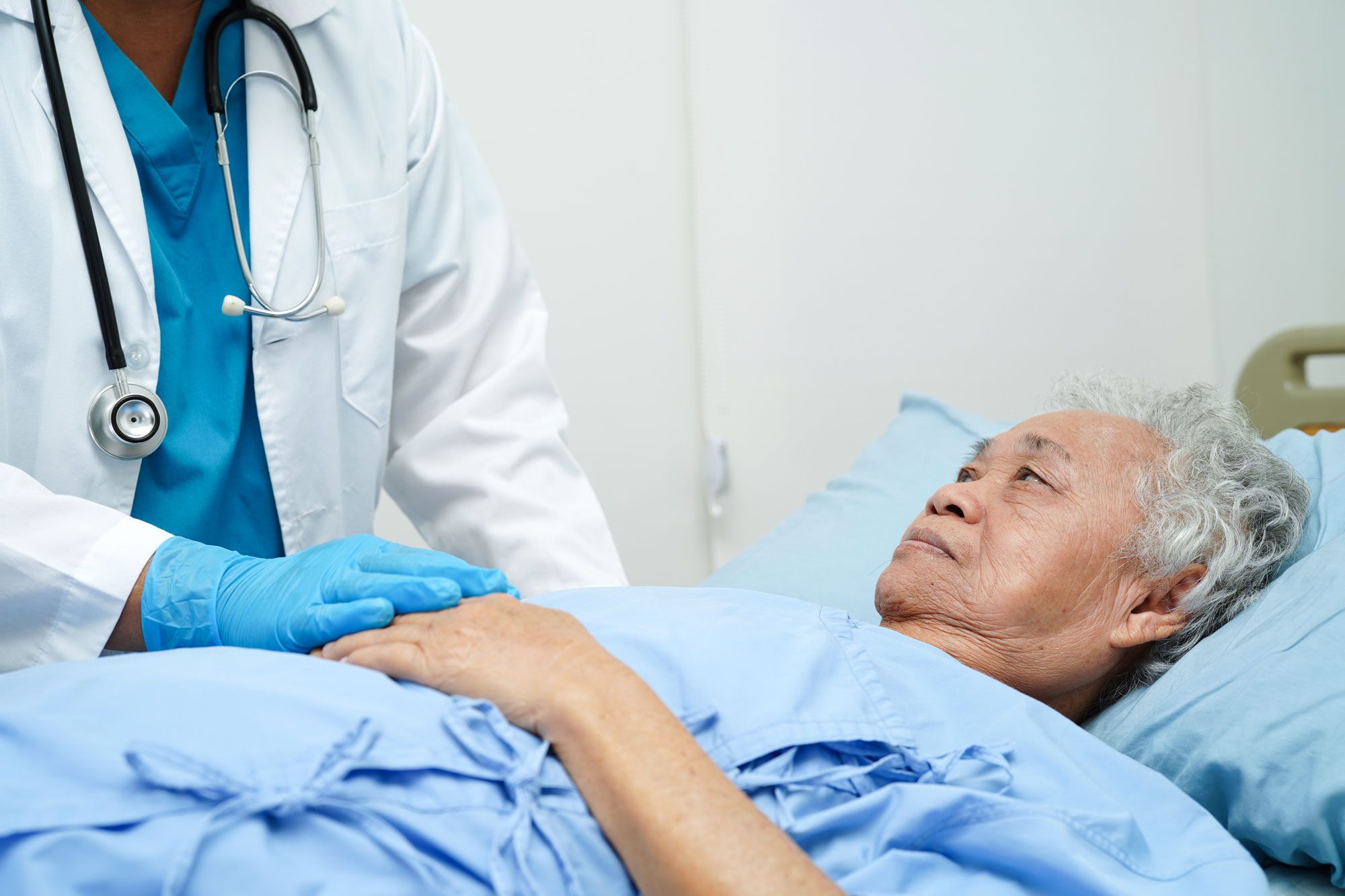 Doctor Holding Hands Asian Elderly Woman Patient