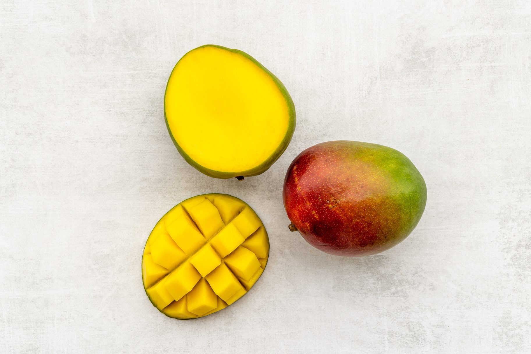 Mango fruit slices and cubes. Tropical fruits layout