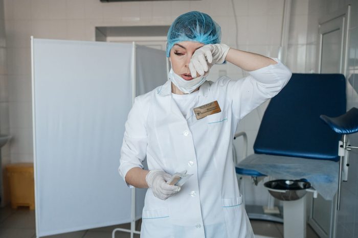 tired woman doctor gynecologist at work