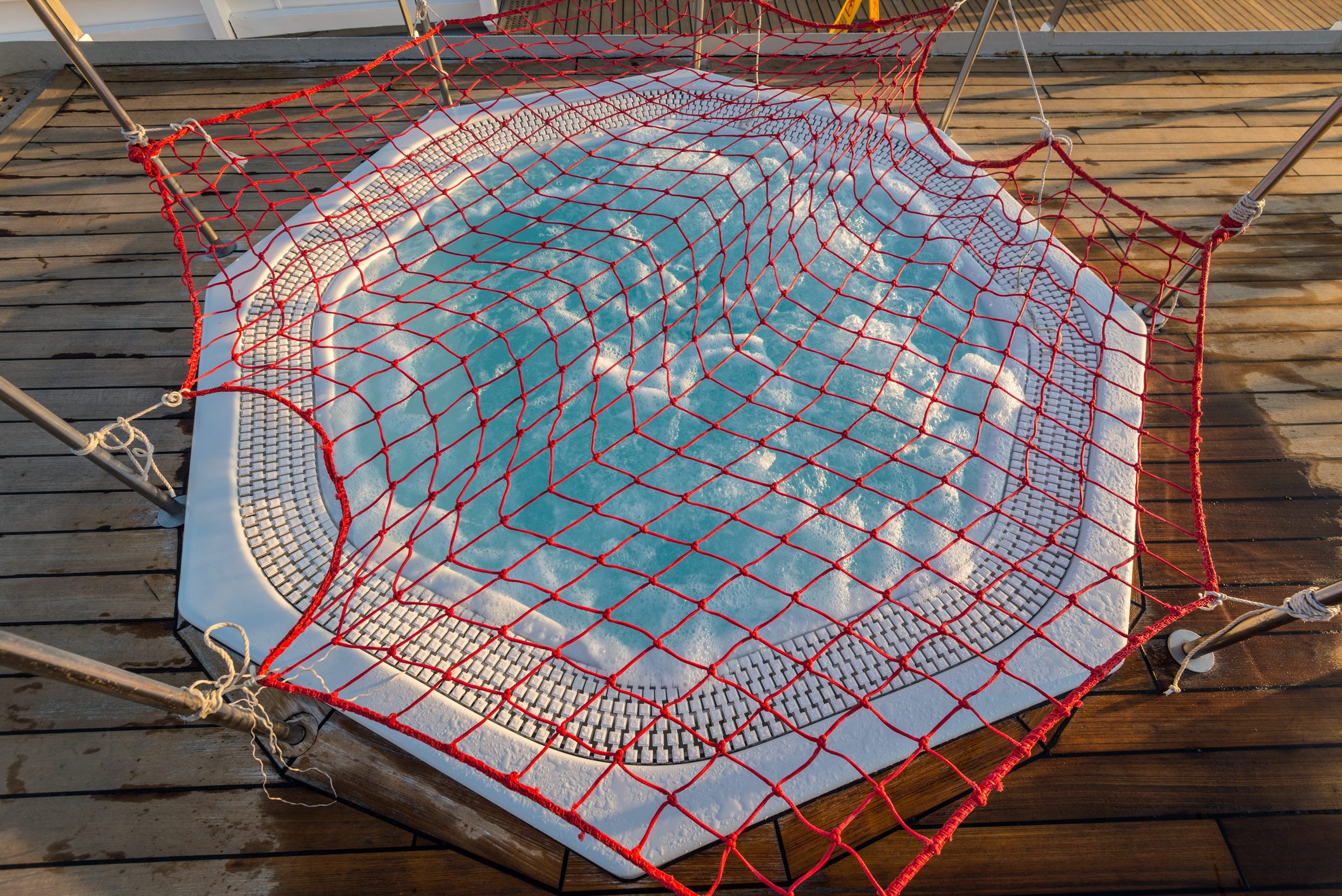 Round Outdoor Hot Tub In A Cruise Ship Is Covered With A Net