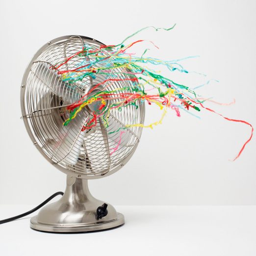 electric fan blowing with streamers representing menopause health symptoms