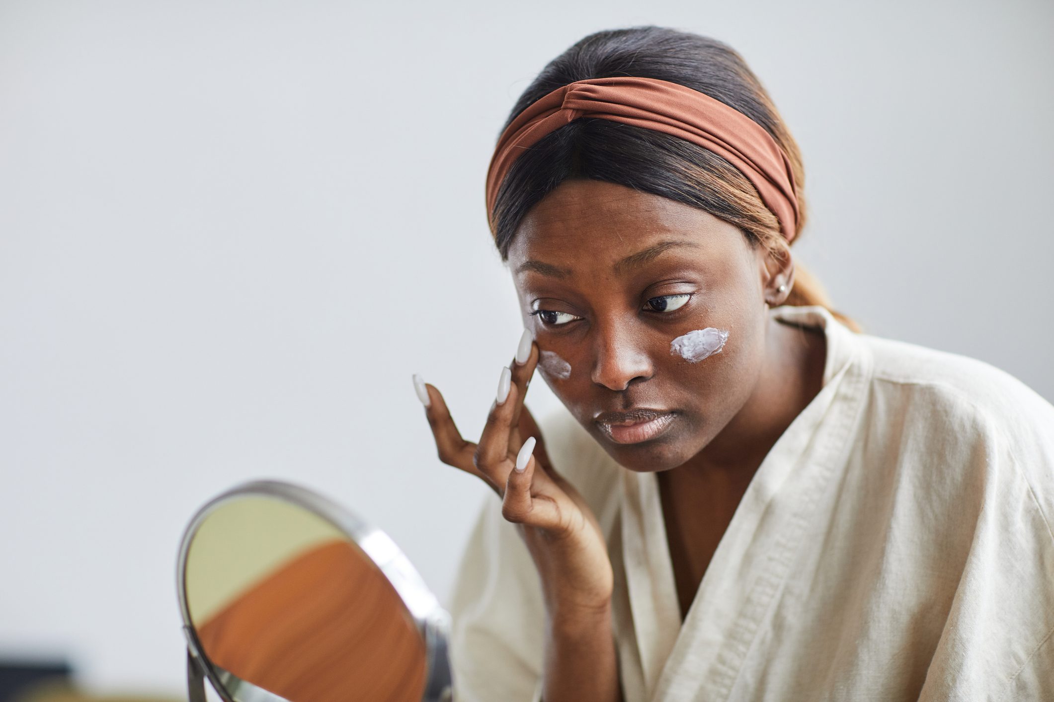 Young African American Woman Enjoying Skincare at Home