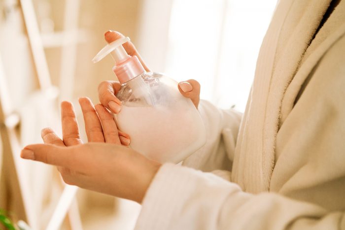 Dispenser with white liquid soap or shower gel, for intimate hygiene. Moisturizing, cleansing