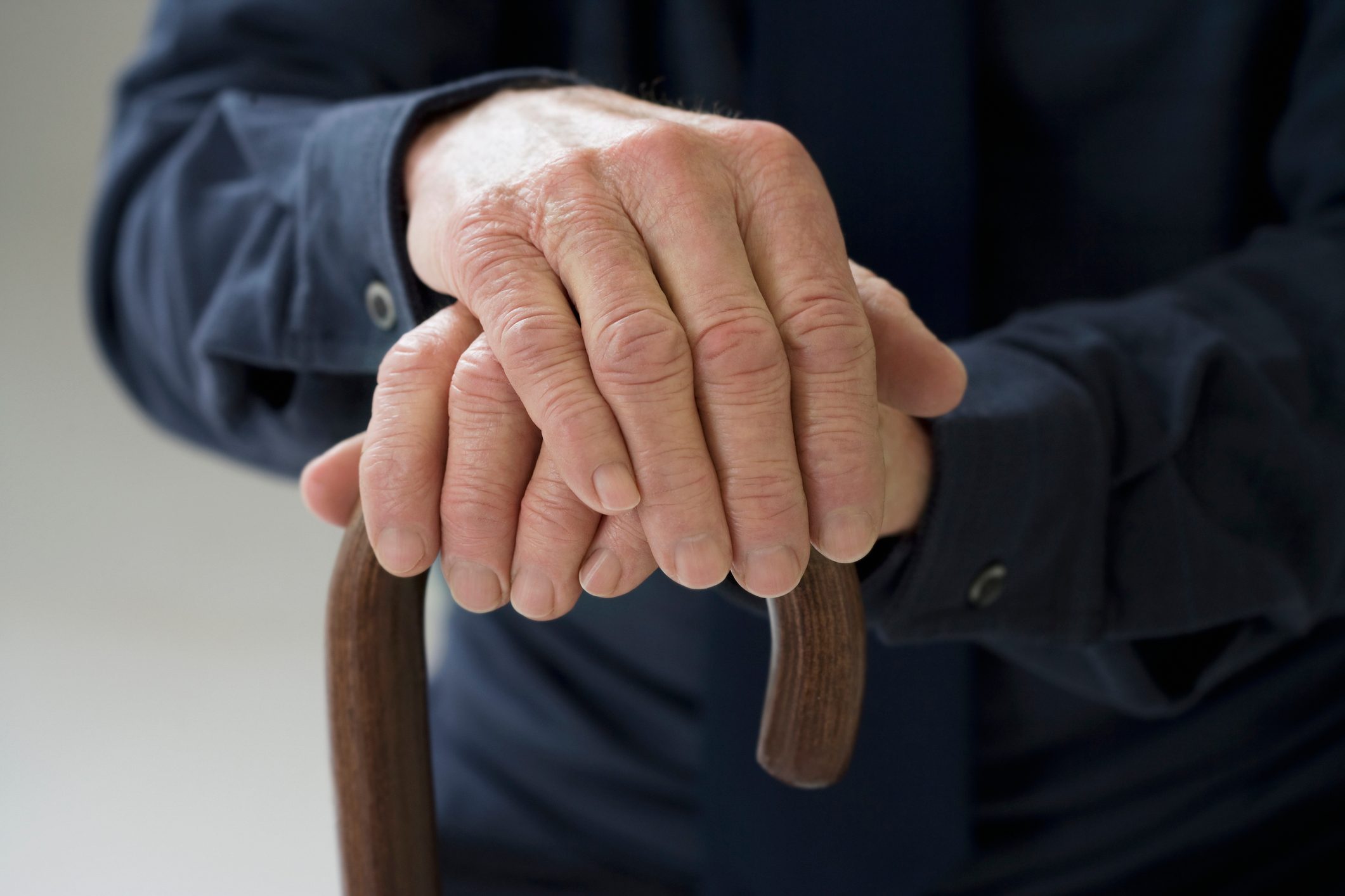 Close up of senior Hispanic manÂ¿s hands on cane