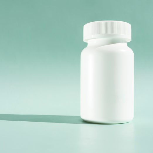 Close Up Of Bottle Against Blue Background