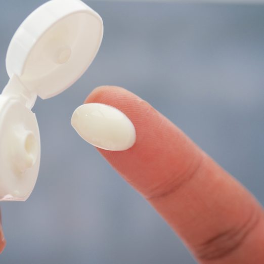 dab of cream on hand