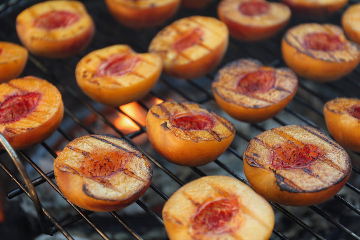 modern grill with cut peaches