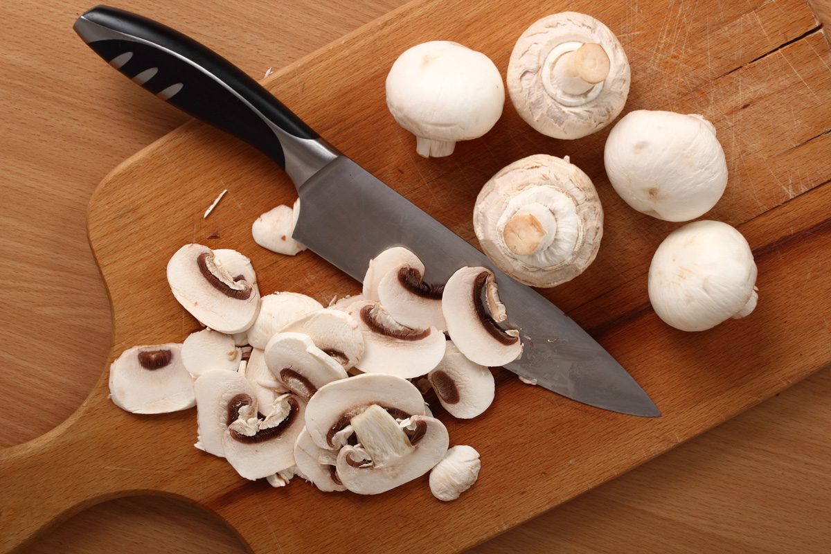 chopped mushrooms on chopping board